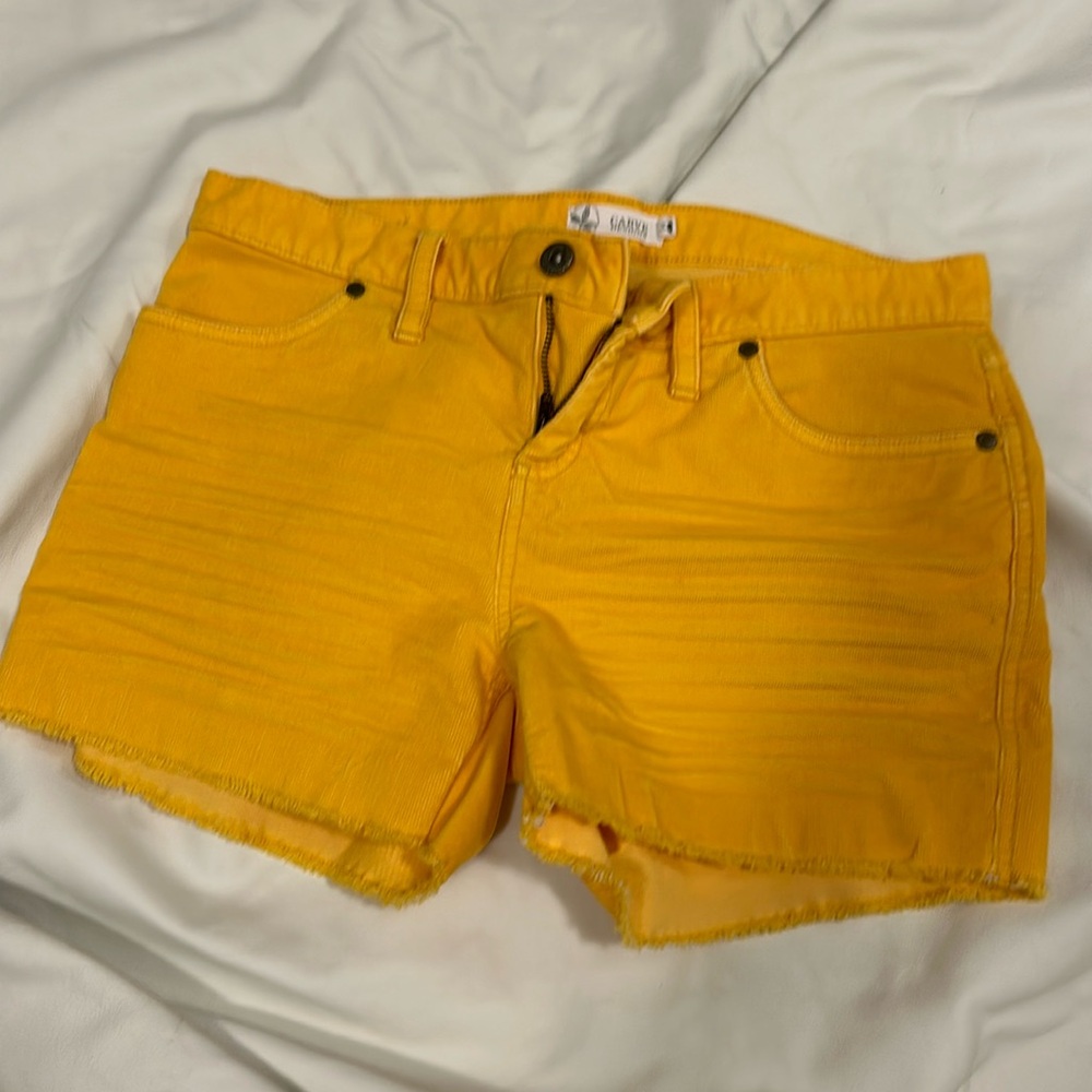 Carve yellow cut off corduroy shorts.